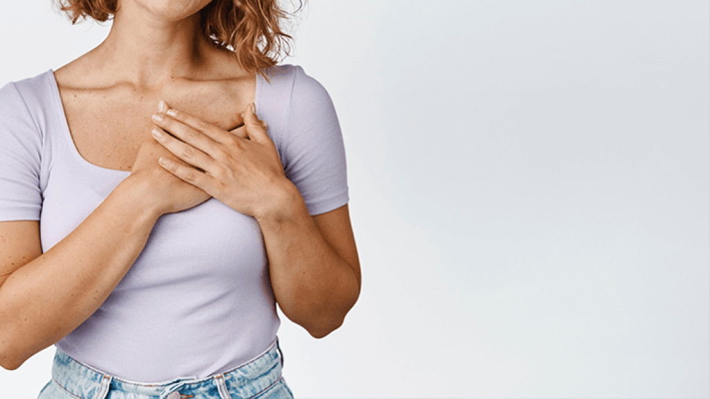 lady standing with hands on chest