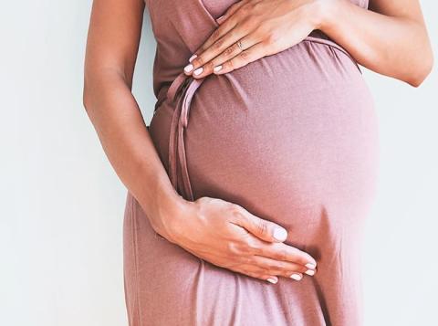 Pregnant woman with relief from heartburn