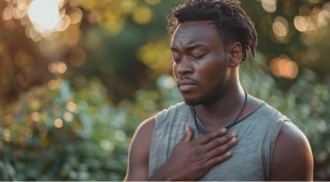 man holding heart for chest pain