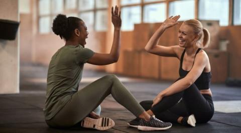 women high-fiving after exercise