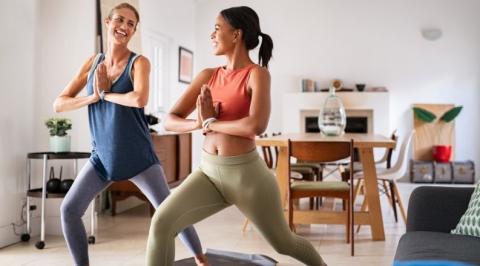 Two women doing yoga