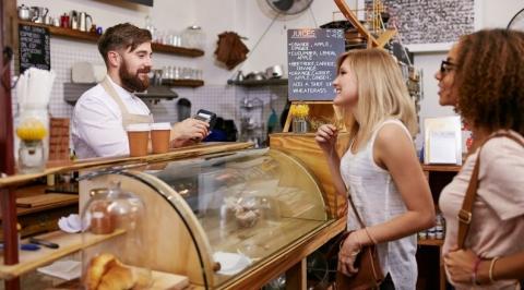 Friends at a coffee shop buying coffee